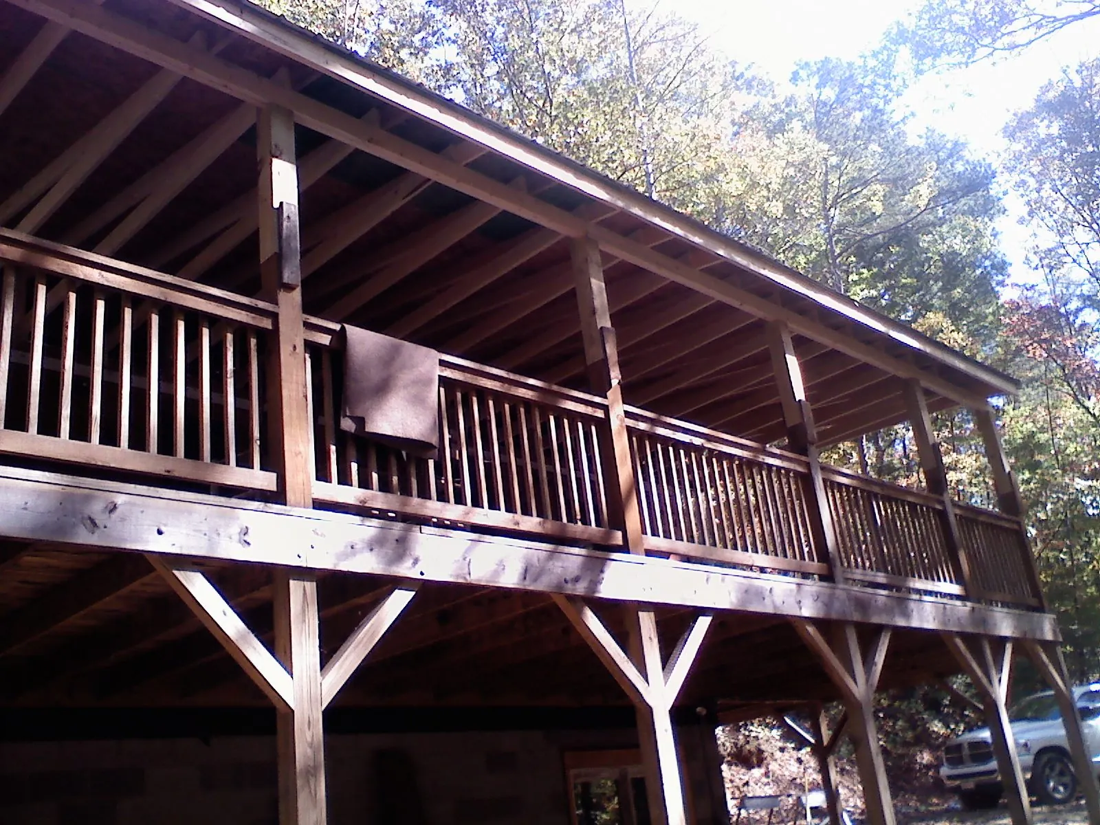 Timber framing under a new elevated porch and deck — Roof Leak Repair in La Porte City by Roofing Brothers